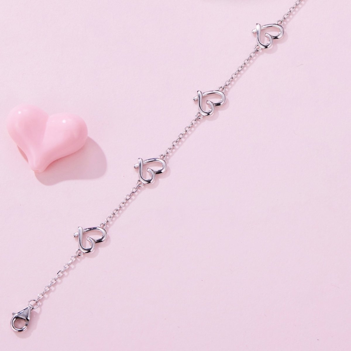 Pangama Jewelry Linked Hearts Silver Bracelet