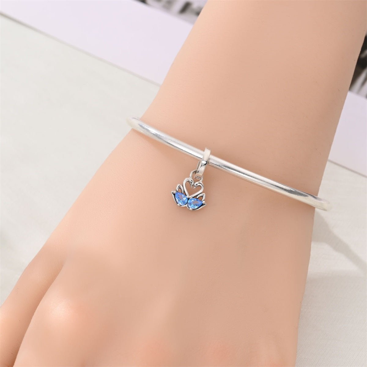 Pangama Jewelry Two Swans with Blue Heart Crystals Dangle Charm