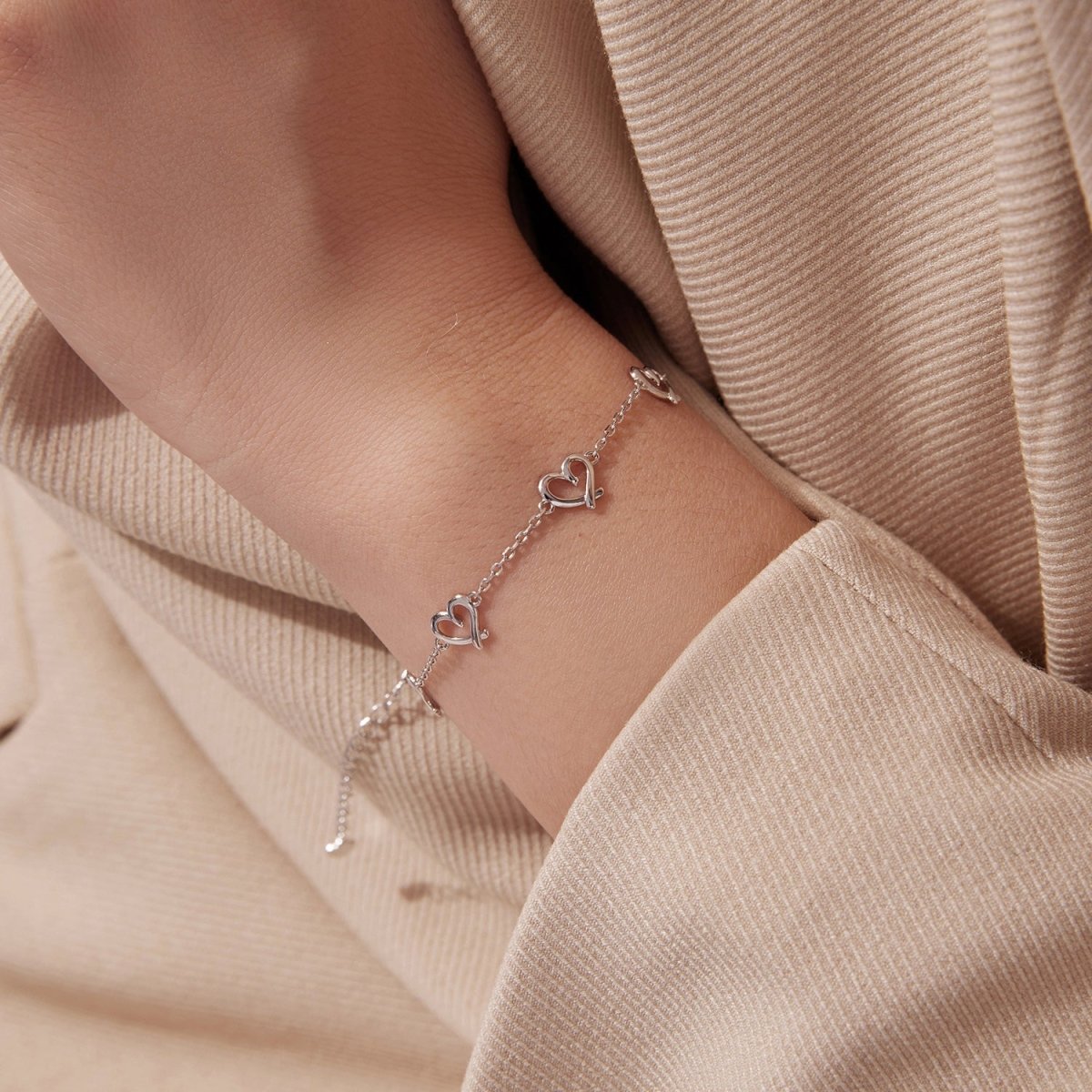 Pangama Jewelry Linked Hearts Silver Bracelet